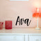 Vinyl Wall Art Decal Girls Custom Name - ’AVA’ Custom Text Name - 12" x 23" - Girls Bedroom Vinyl Wall Decals - Cute Wall Art Decals for Baby Girl Nursery Room Decor (12" x 23"; Black Cursive) Black 12" x 23"