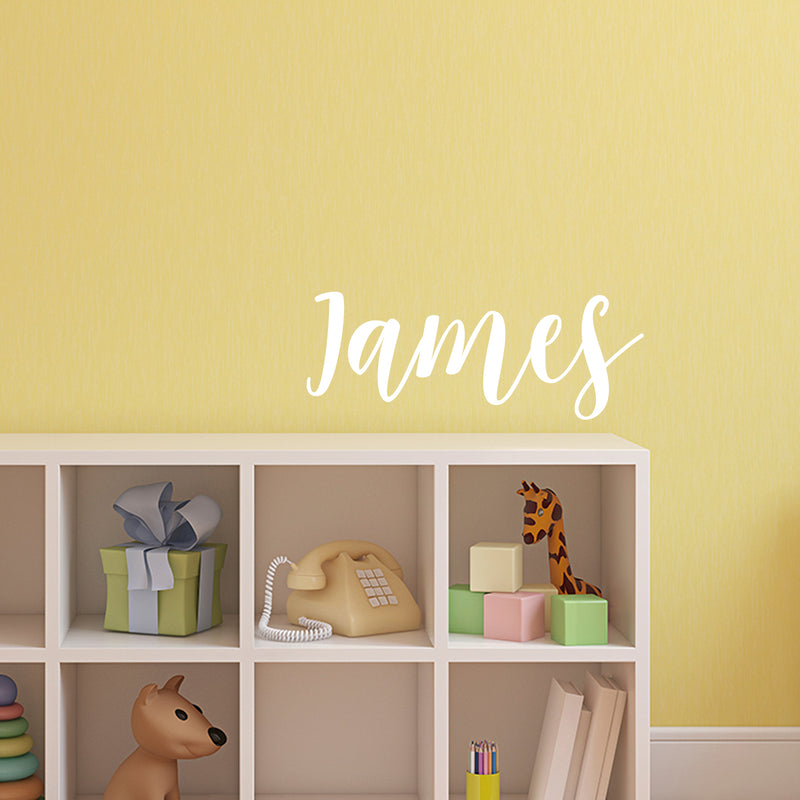 Vinyl Wall Art Decal Boys Custom Name - ’James’ Custom Text Name - 12" x 34" - Little Boys Bedroom Vinyl Wall Decals - Cute Wall Art Decals for Baby Boy Nursery Room Decor (12" x 34"; White Cursive) White 12" x 34"